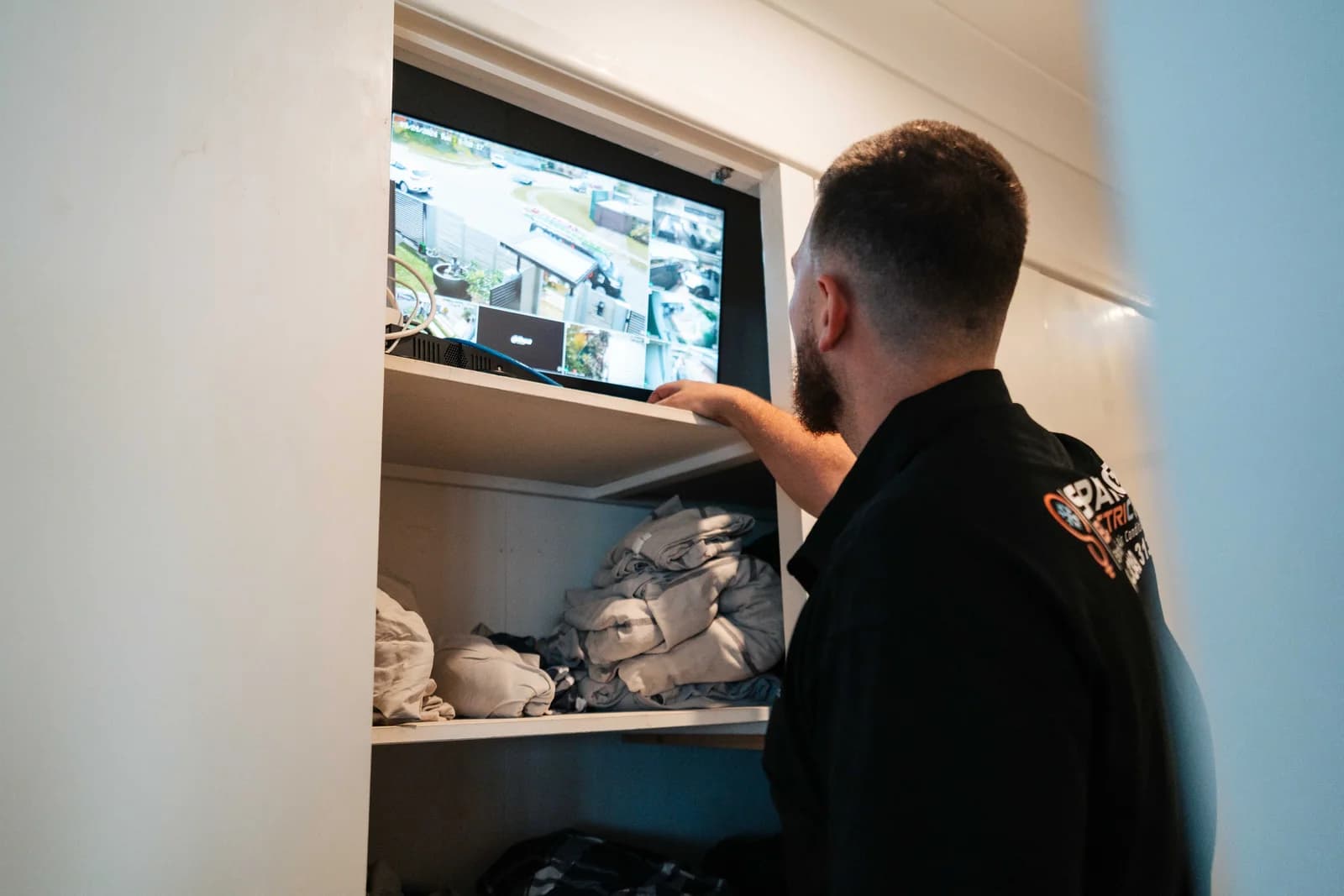 Spanos ElectriCool technician checking a CCTV surveillance system in Mansfield