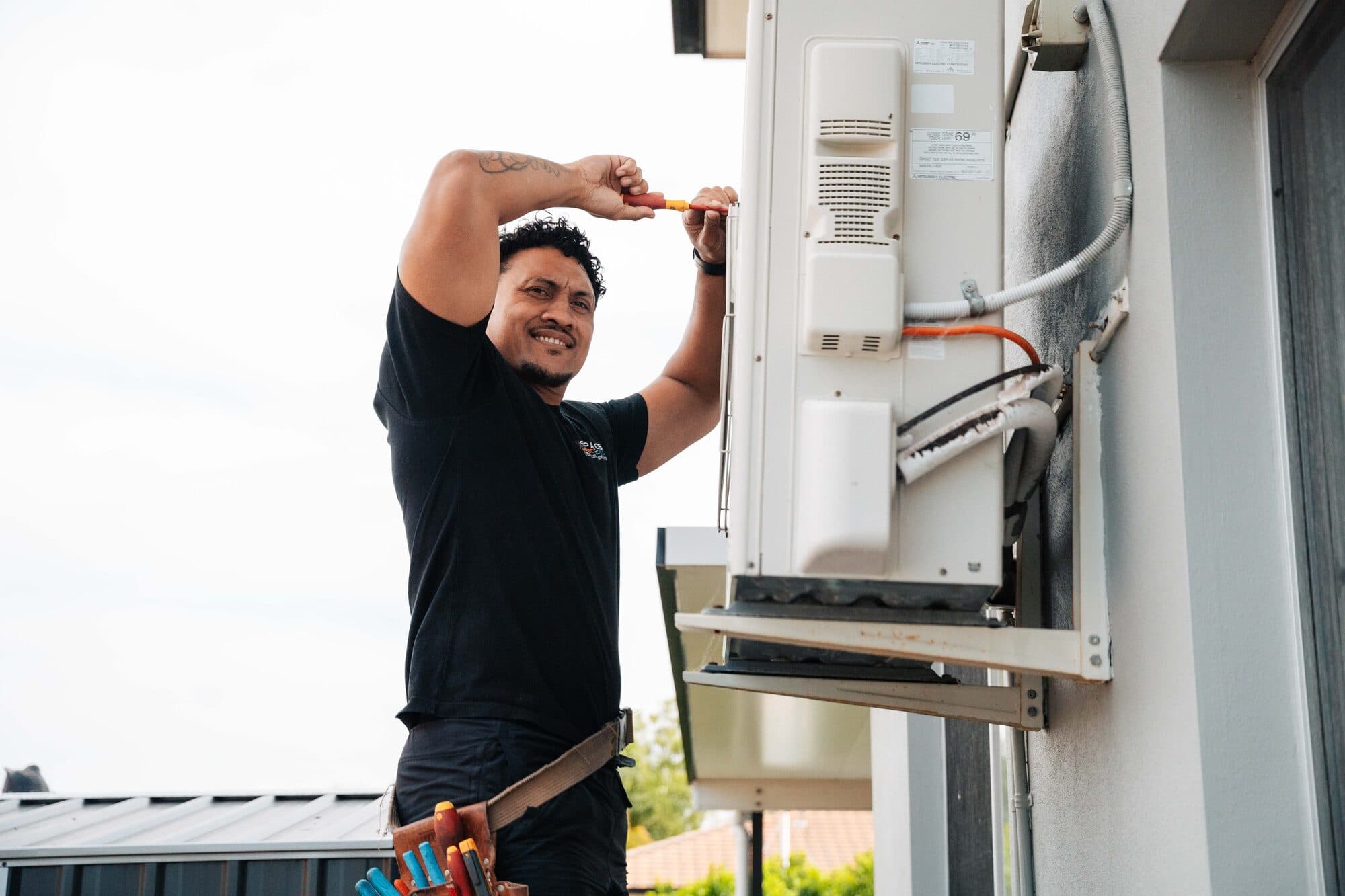 Spanos Air Conditioning Technician Working